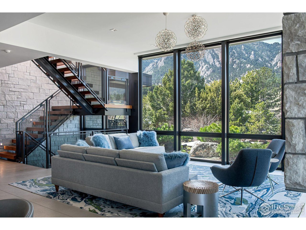 1775 Deer Valley Road Boulder, CO 80305 - Photo 9 of 40 a living room with furniture and a large window