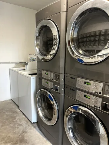 a utility room with sink dryer and dryer