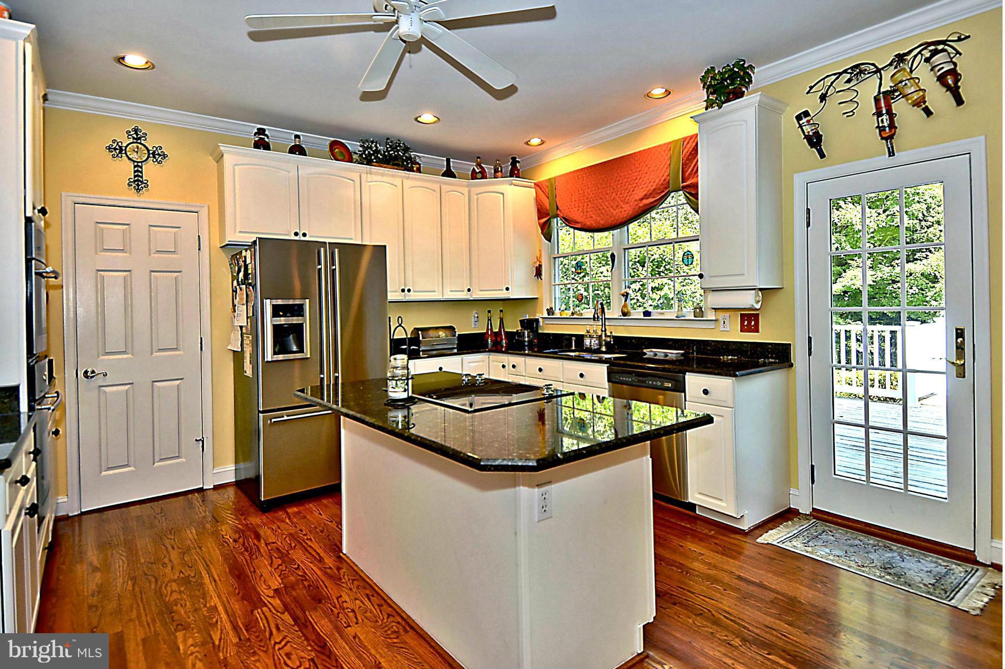 2702 Howard Grove Road Davidsonville, MD 21035 - Photo 11 of 30 Gourmet Kitchen Boasting Cooktop Island