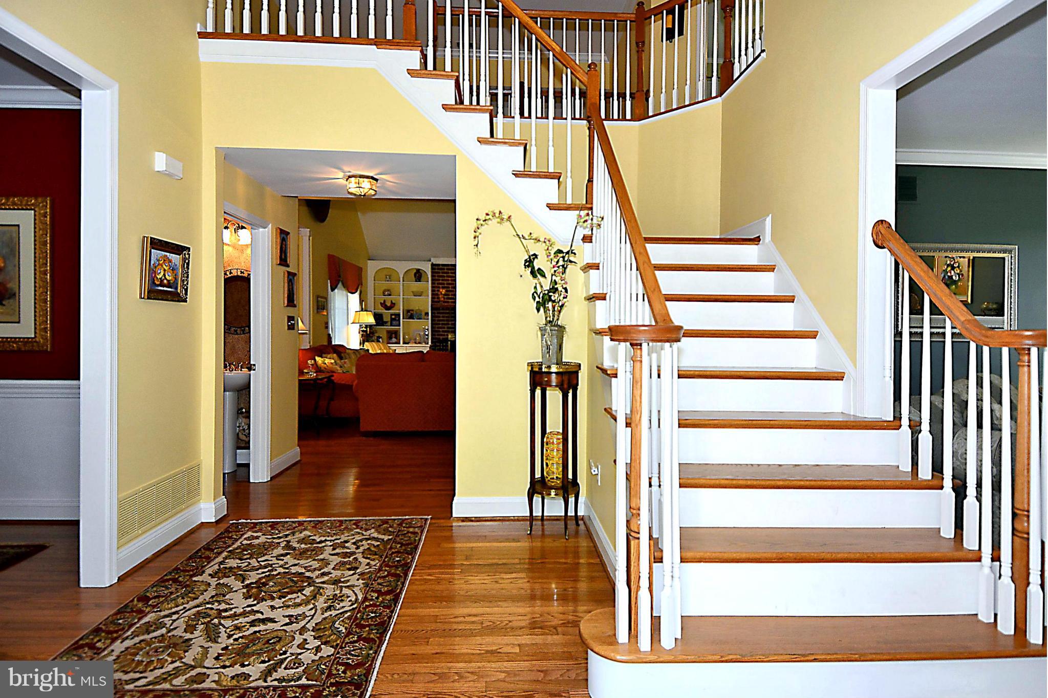 2702 Howard Grove Road Davidsonville, MD 21035 - Photo 7 of 30 Foyer Showcasing Expert Millwork / Wood Floors