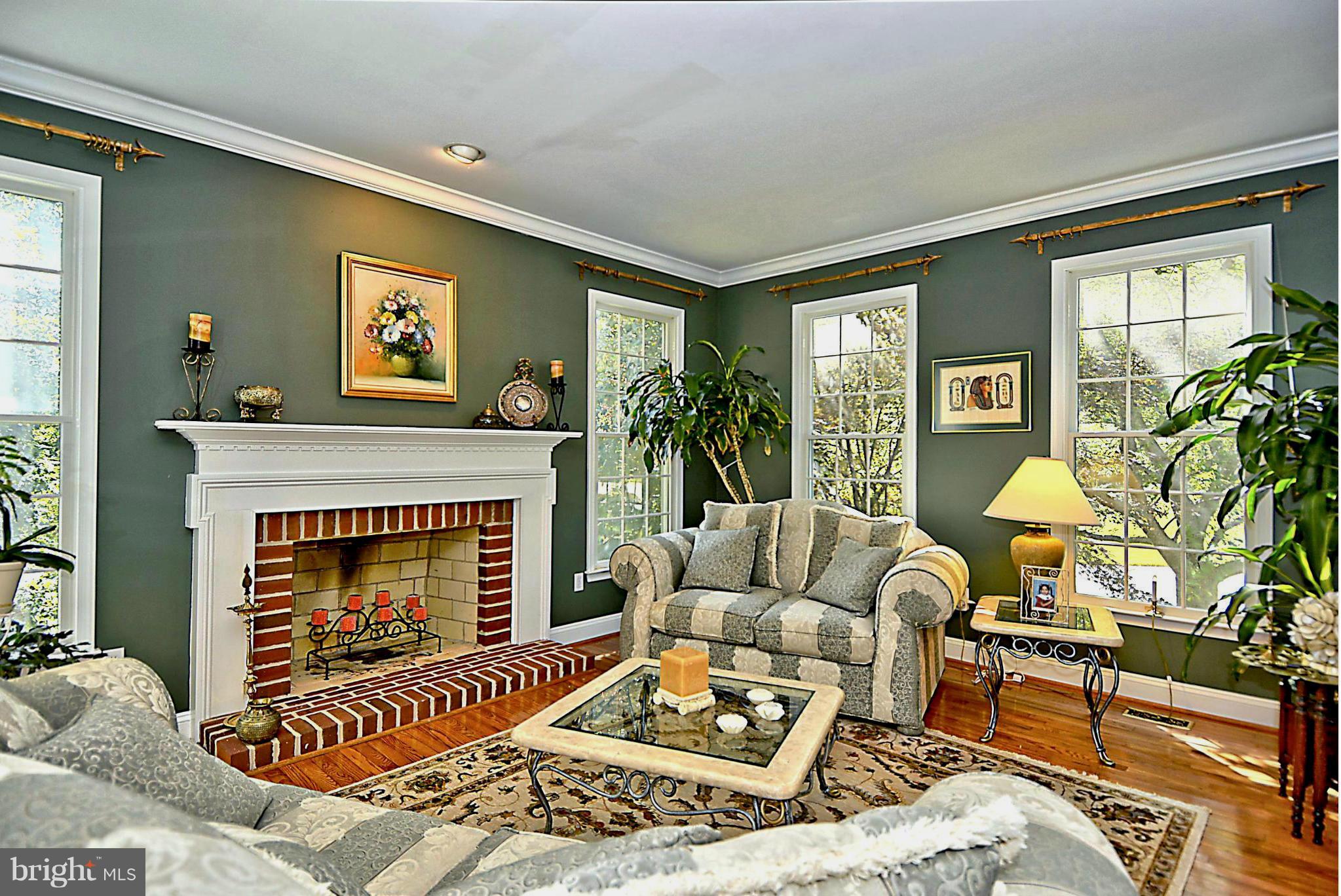2702 Howard Grove Road Davidsonville, MD 21035 - Photo 8 of 30 Light-Filled Living Room / Brick Hearth Fireplace