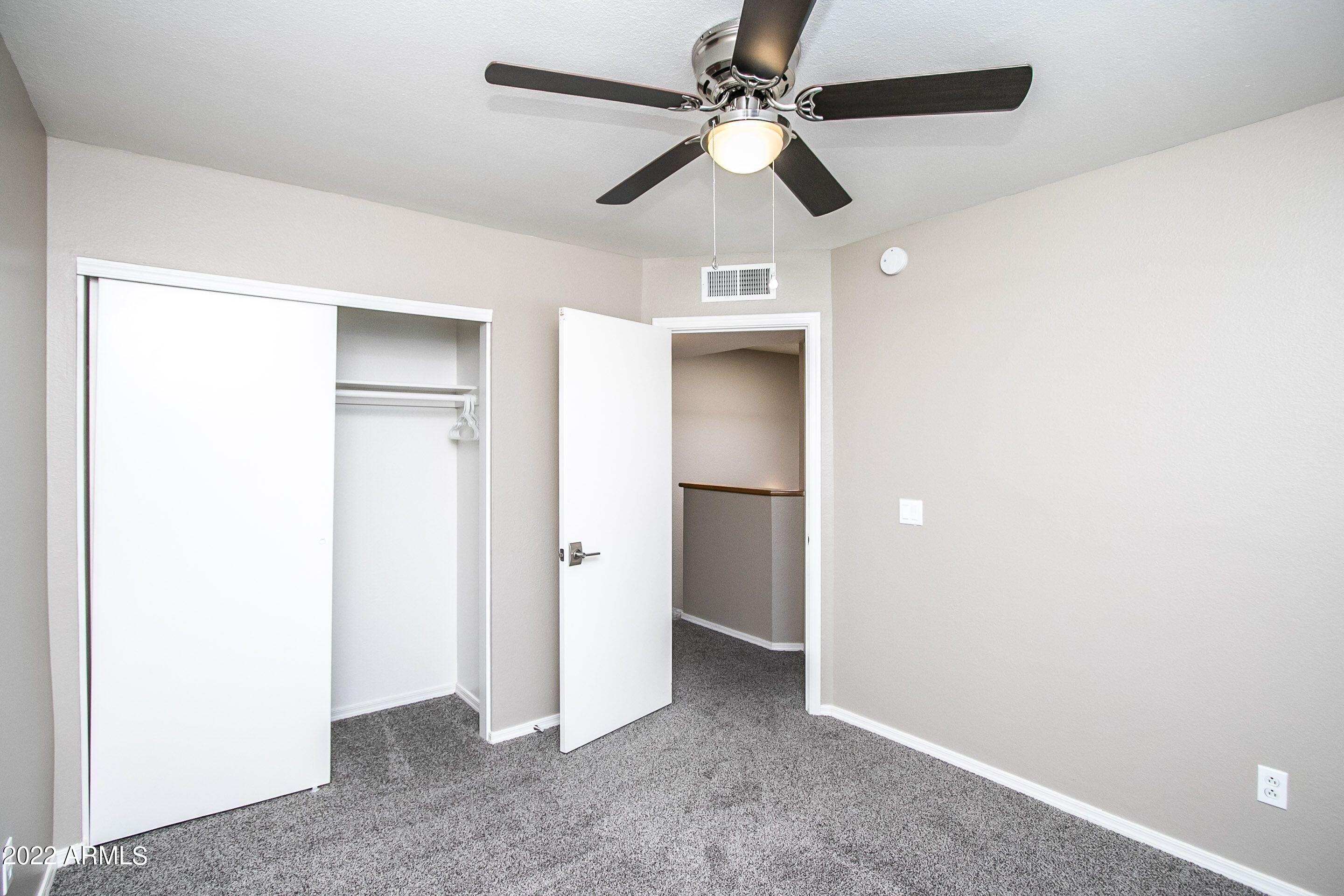 626 West 14th Street Tempe, AZ 85281 - Photo 16 of 27 an empty room with closet and a ceiling fan
