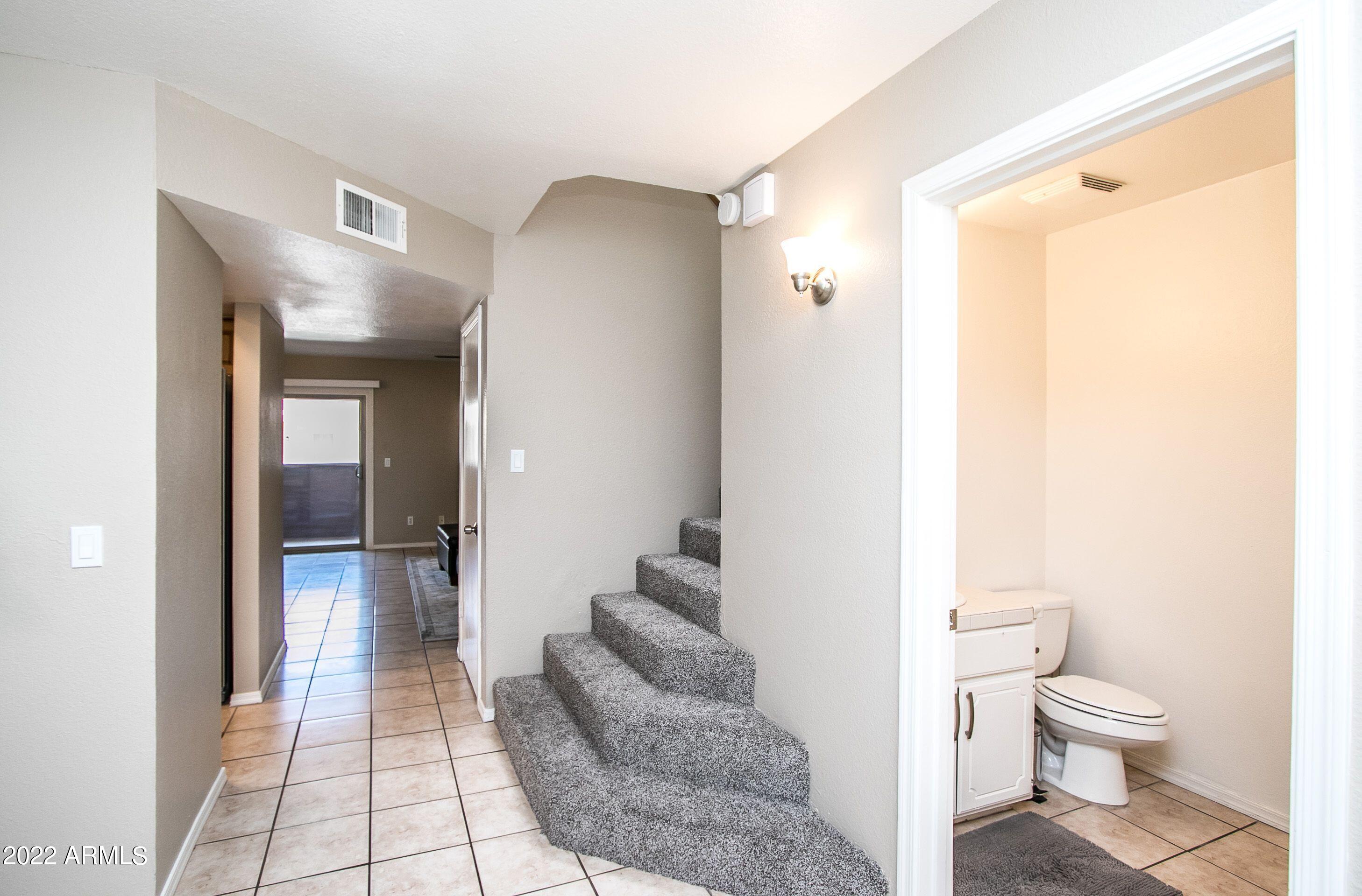 626 West 14th Street Tempe, AZ 85281 - Photo 4 of 27 a bathroom with a toilet sink and shower