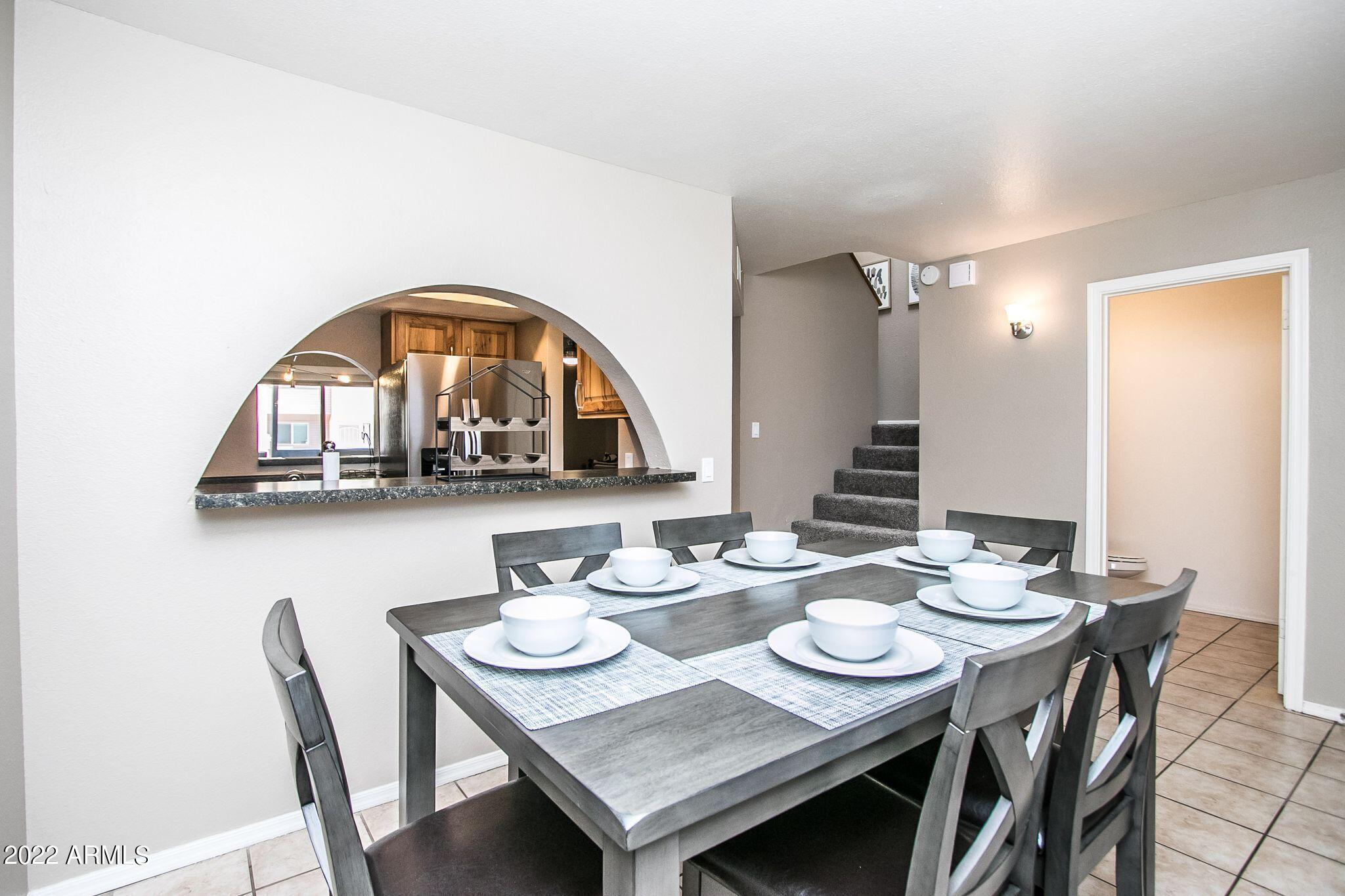 626 West 14th Street Tempe, AZ 85281 - Photo 6 of 27 a view of a dining room with furniture and wooden floor
