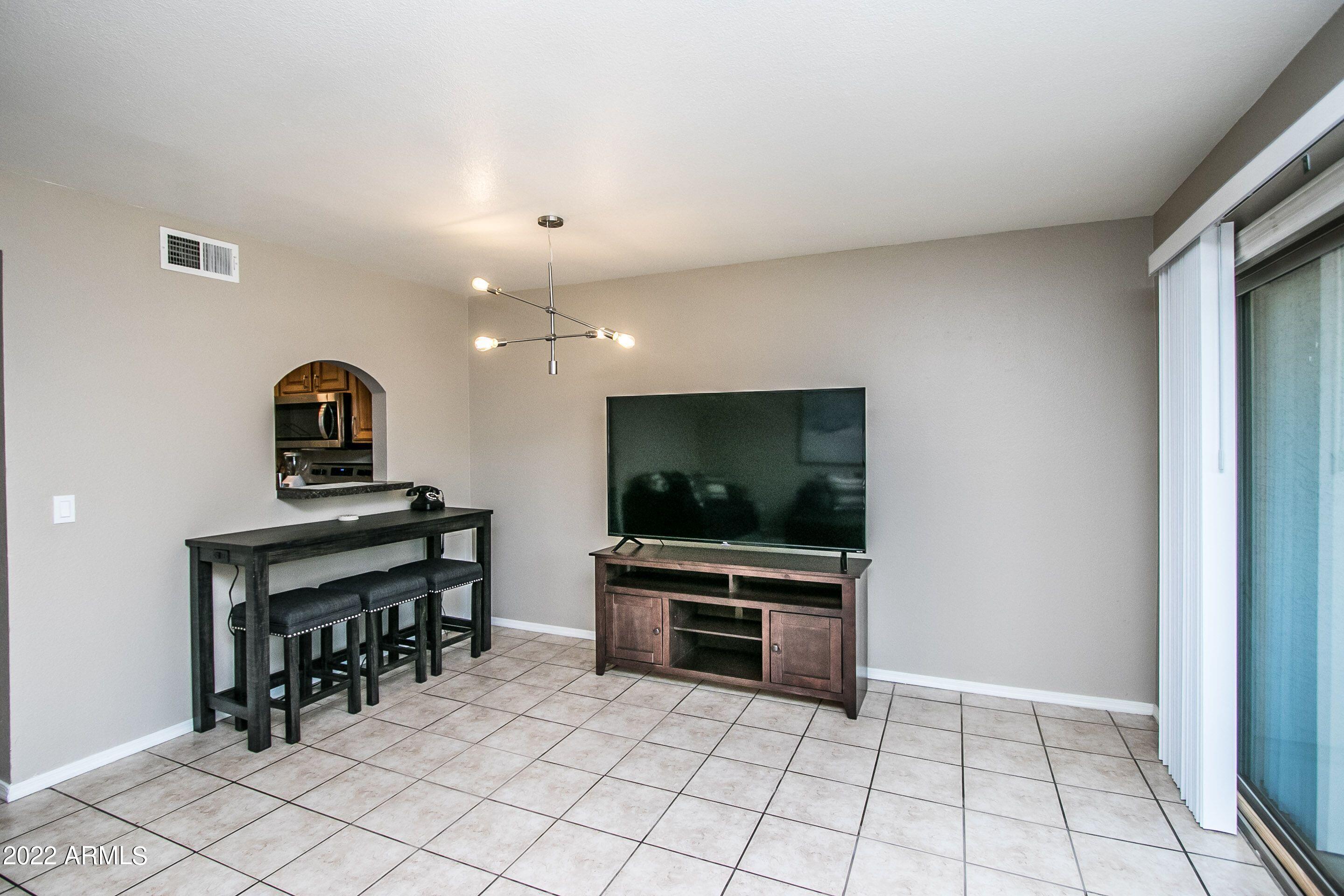 626 West 14th Street Tempe, AZ 85281 - Photo 9 of 27 a living room with furniture and flat screen tv