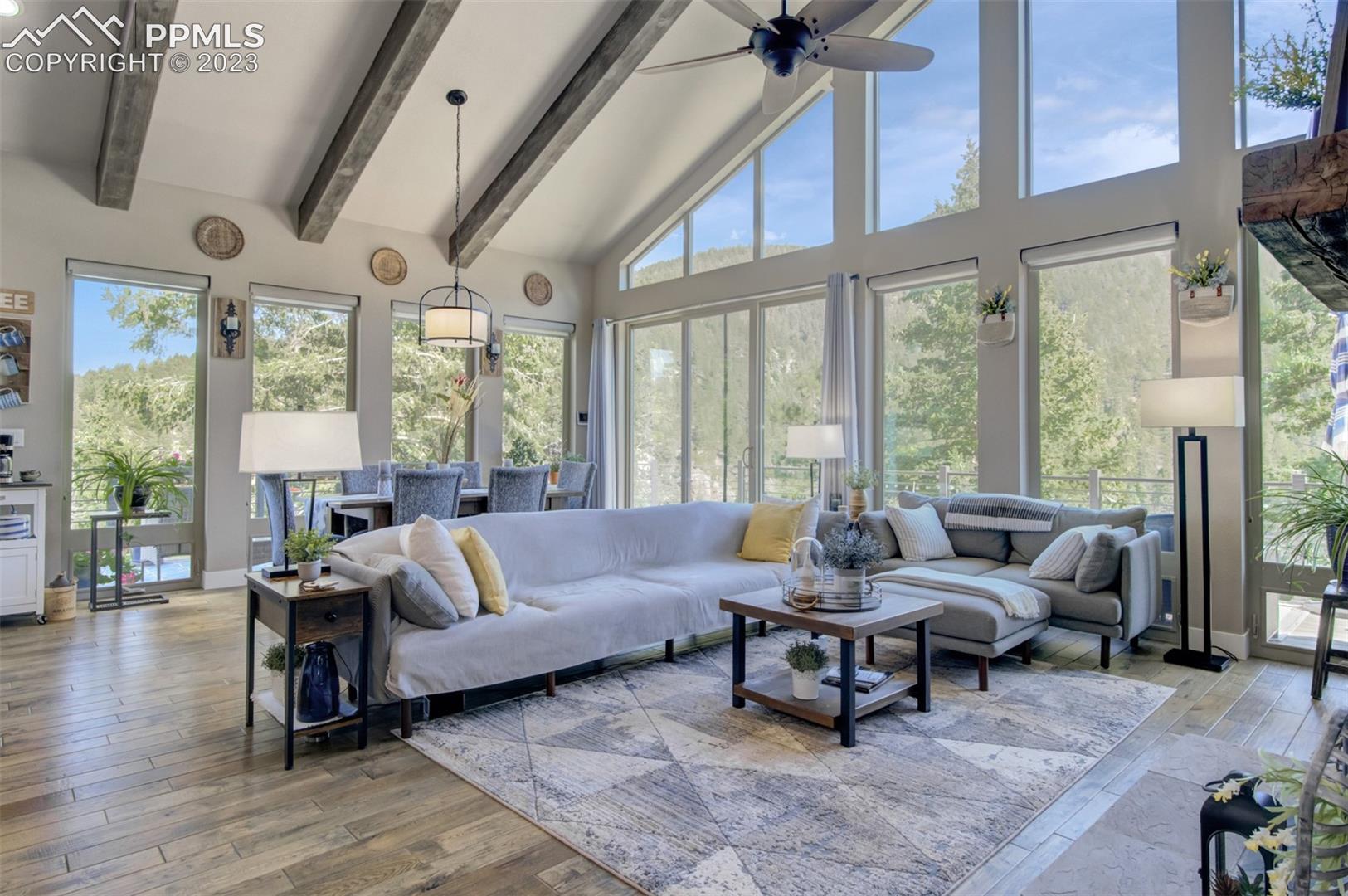 5020 South High Ridge View Manitou Springs, CO 80829 - Photo 15 of 46 View of the living room loooking toward the dining area and the walk out to the wrap around deck!
