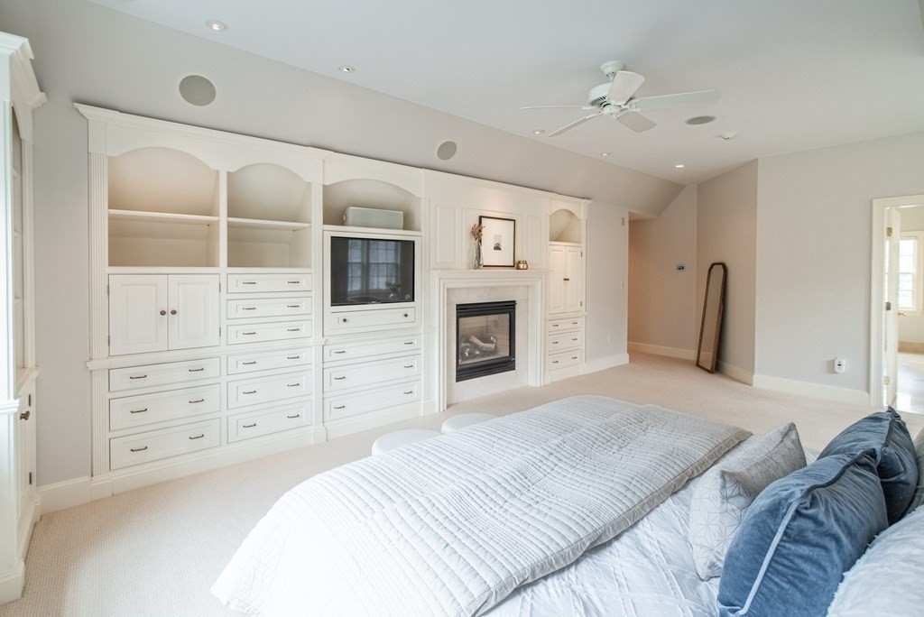 49 Tanglewood Road Wellesley, MA 02481 - Photo 20 of 35 a bedroom with a bed and a flat screen tv