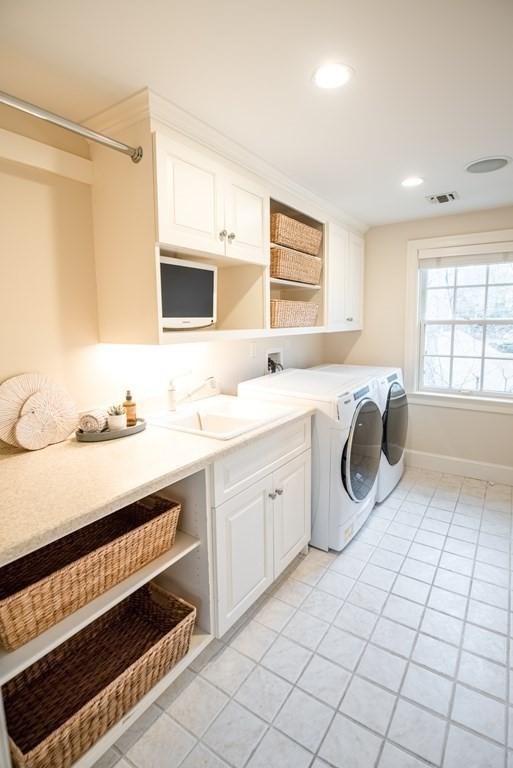 49 Tanglewood Road Wellesley, MA 02481 - Photo 26 of 35 a spacious bathroom with a sink a mirror and a bathtub