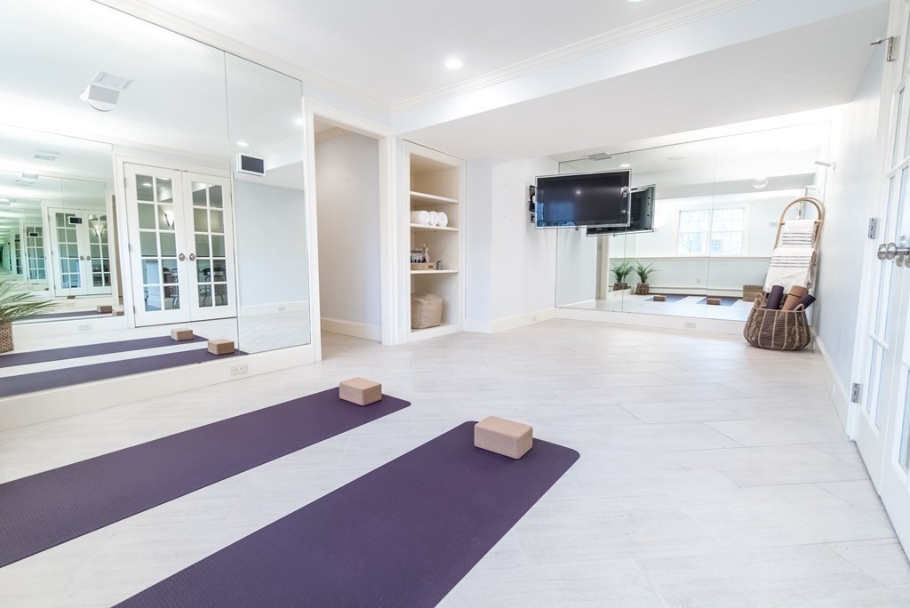 49 Tanglewood Road Wellesley, MA 02481 - Photo 32 of 35 a bedroom with furniture and a flat screen tv