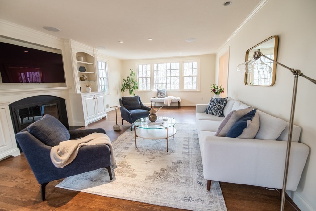49 Tanglewood Road Wellesley, MA 02481 - Photo 4 of 35 a living room with furniture fireplace and a flat screen tv