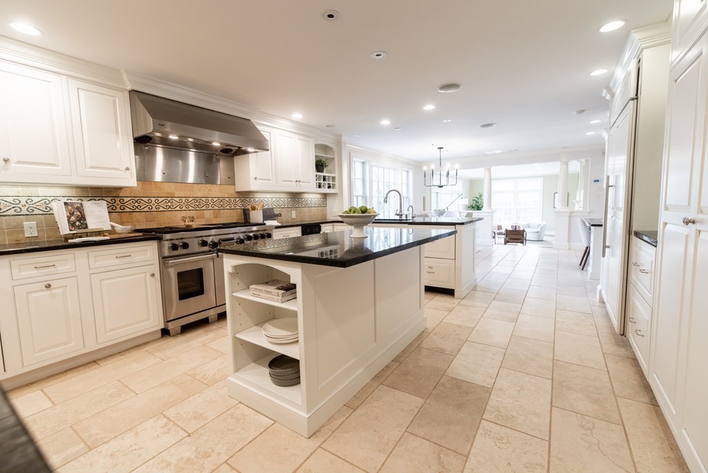 49 Tanglewood Road Wellesley, MA 02481 - Photo 7 of 35 a kitchen with stainless steel appliances granite countertop a stove a sink and a refrigerator