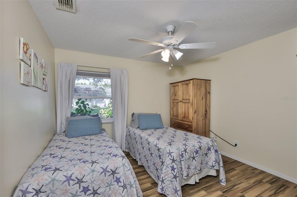 2034 Hawkhurst Circle, Unit 178 Sun City Center, FL 33573 - Photo 16 of 94 a bedroom with a large bed and a window