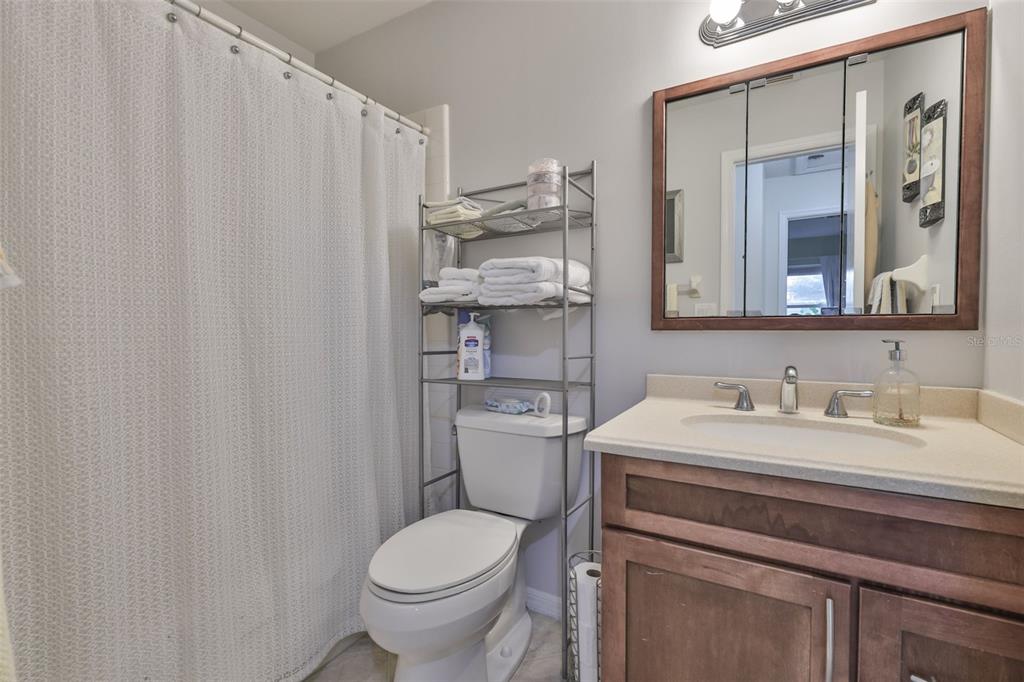 2034 Hawkhurst Circle, Unit 178 Sun City Center, FL 33573 - Photo 19 of 94 a bathroom with a sink toilet and mirror