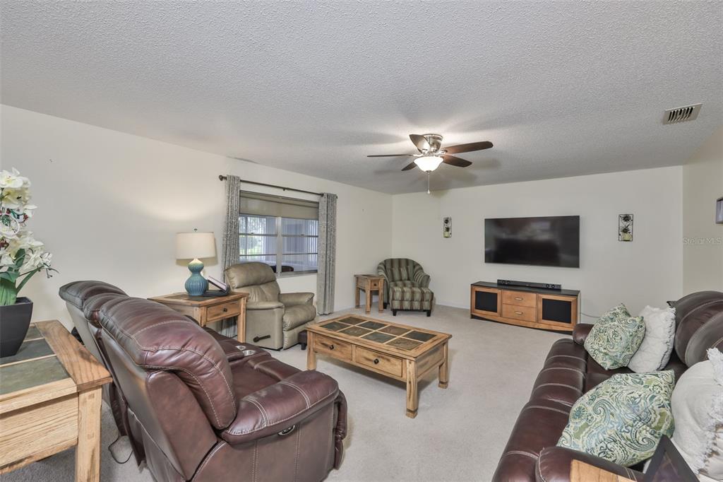 2034 Hawkhurst Circle, Unit 178 Sun City Center, FL 33573 - Photo 21 of 94 a living room with furniture and a flat screen tv