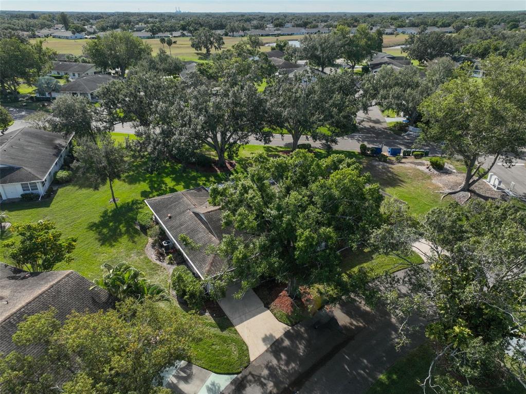 2034 Hawkhurst Circle, Unit 178 Sun City Center, FL 33573 - Photo 93 of 94 an aerial view of residential house with outdoor space and trees all around