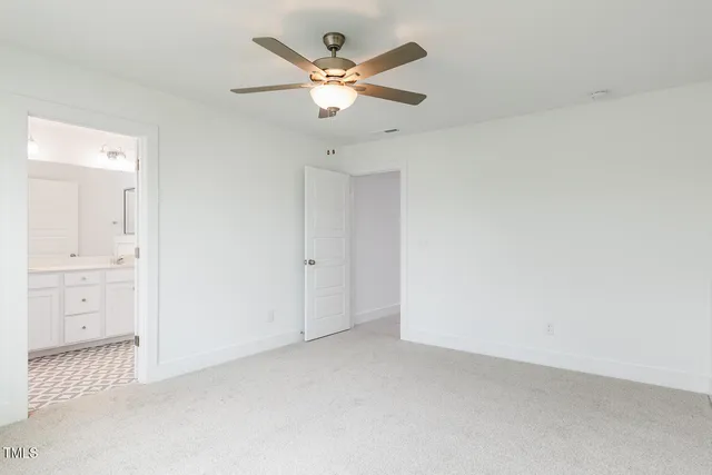 an empty room with closet and window