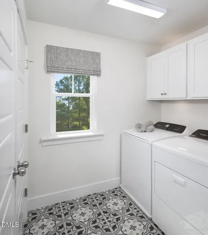 a utility room with a window dryer and washer