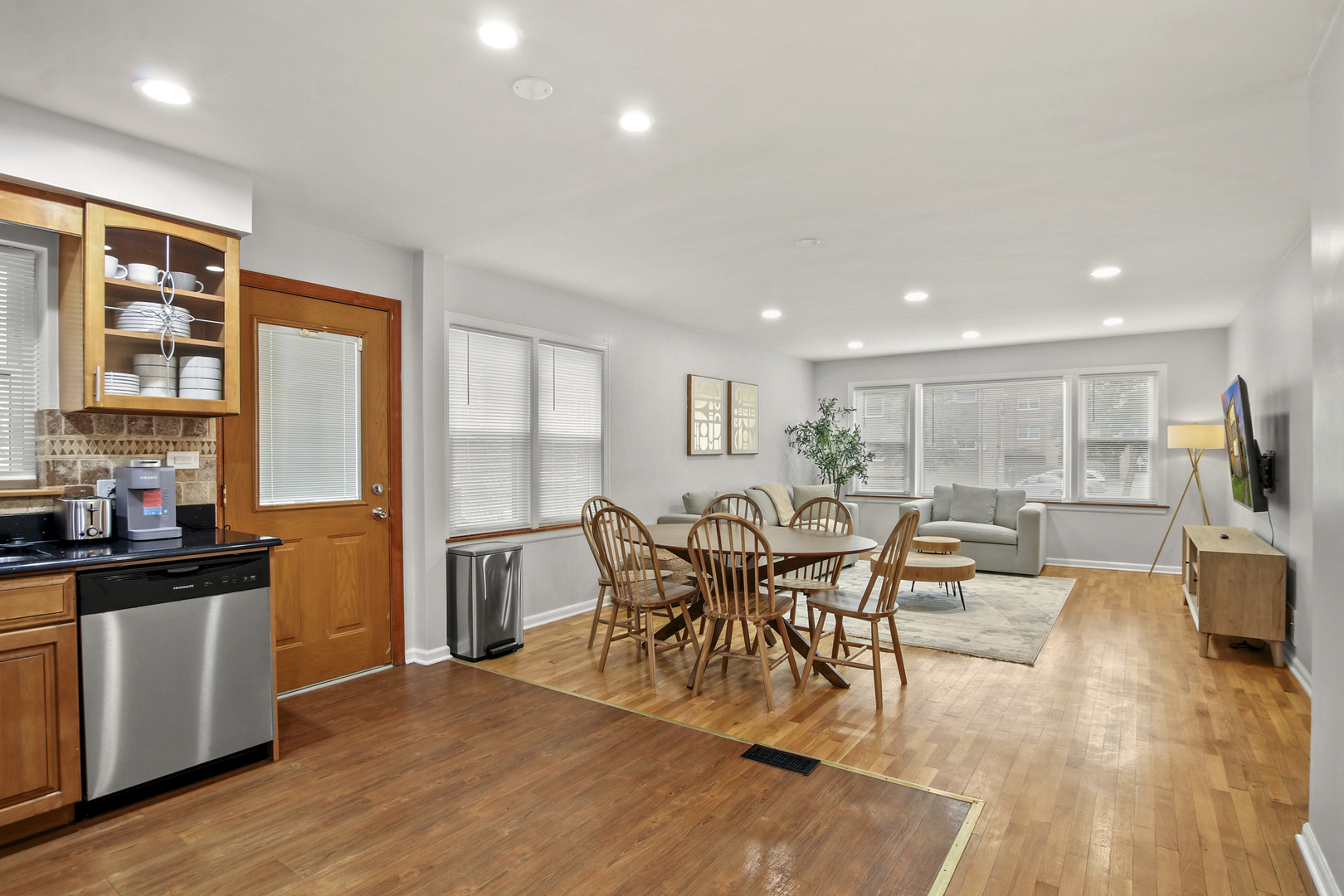 236 Callan Avenue, Unit 2 Evanston, IL 60202 - Photo 5 of 14 a view of a dining room with furniture window and wooden floor