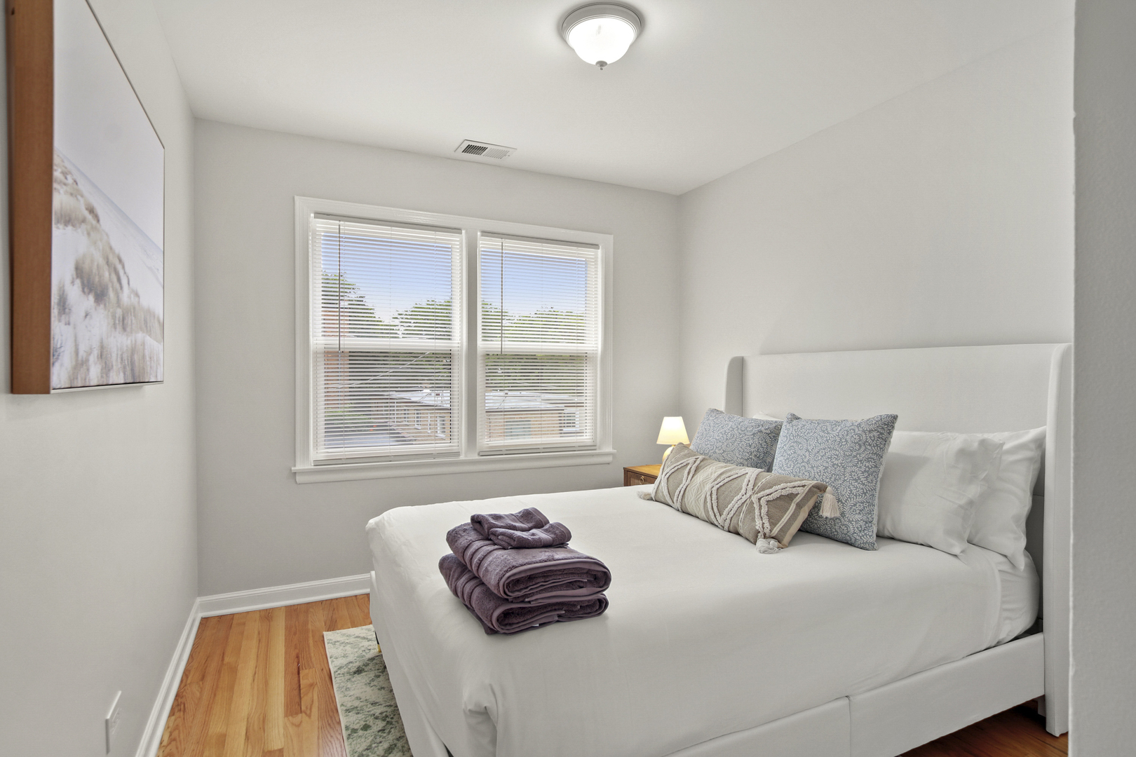 236 Callan Avenue, Unit 2 Evanston, IL 60202 - Photo 10 of 14 a bedroom with a bed and a window