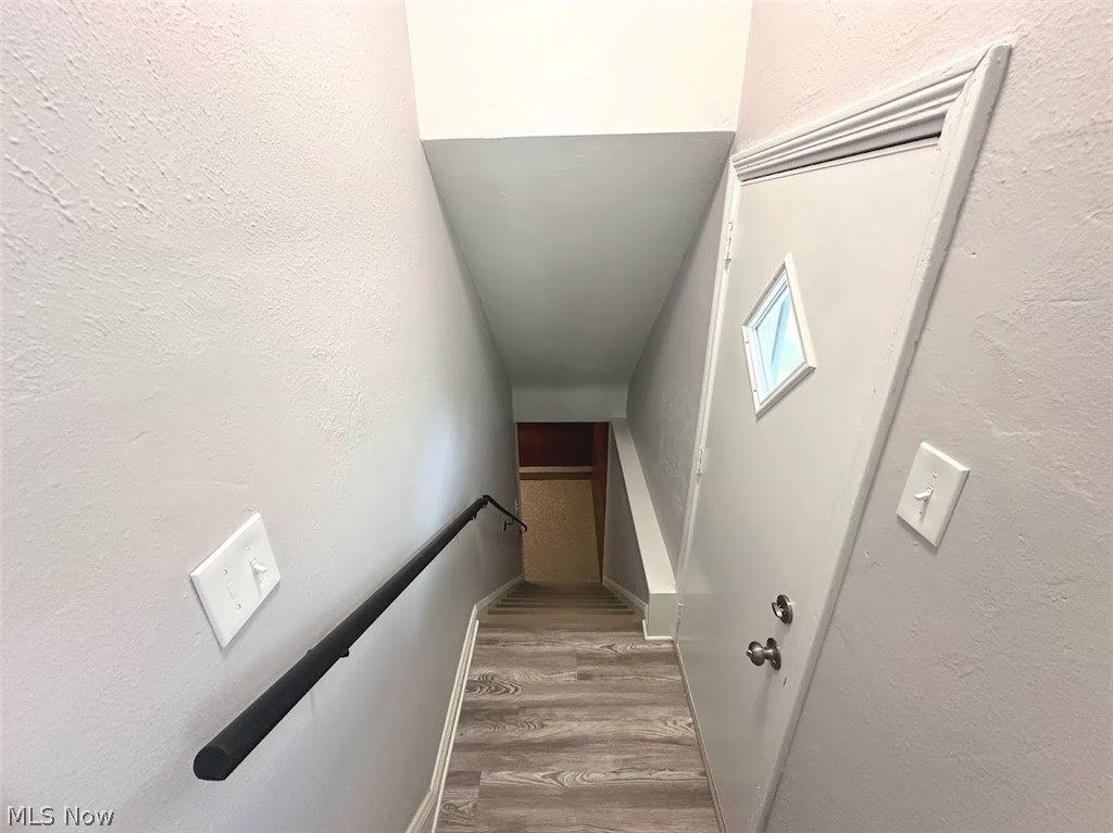 4227 Eastway Road South Euclid, OH 44121 - Photo 14 of 18 Staircase with wood-type flooring