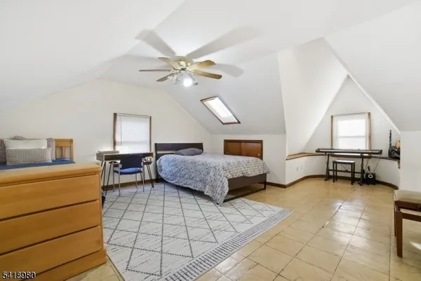 a bedroom with furniture and a chandelier