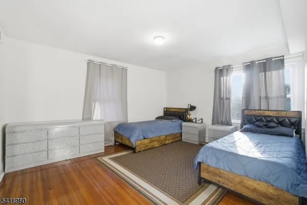 a bedroom with two beds and painted walls