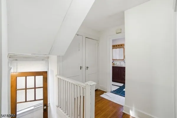 a view of entryway with wooden floor