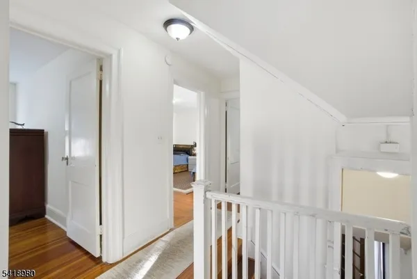 a view of a hallway with a door
