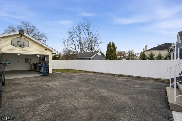 a view of a house with a yard and garage