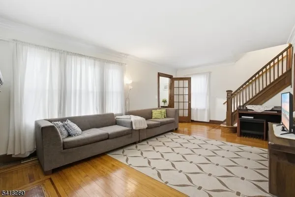 a living room with furniture and a rug