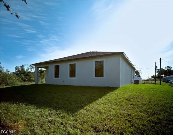 a house with yard in front of it