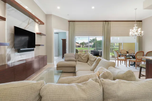 a kitchen with stainless steel appliances granite countertop a sink a oven and a large window