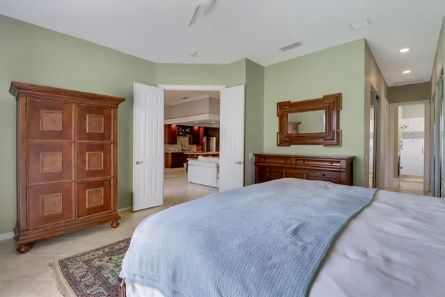 a view of a house with a swimming pool and a yard