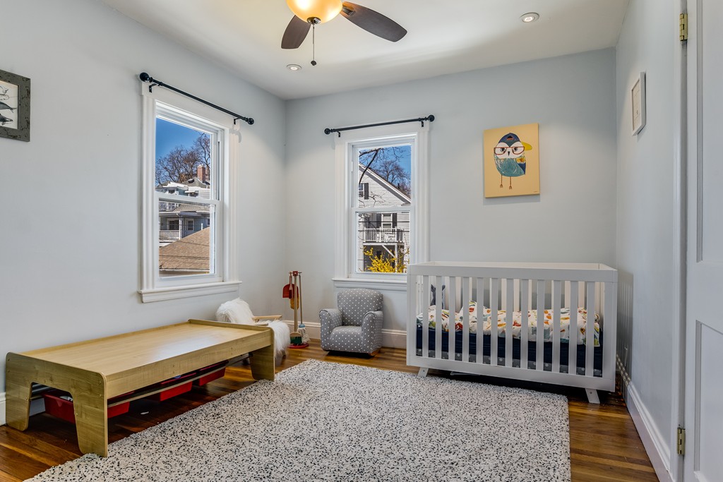 21 Pershing Road, Unit 2 Boston, MA 02130 - Photo 11 of 17 a bedroom with furniture and a window
