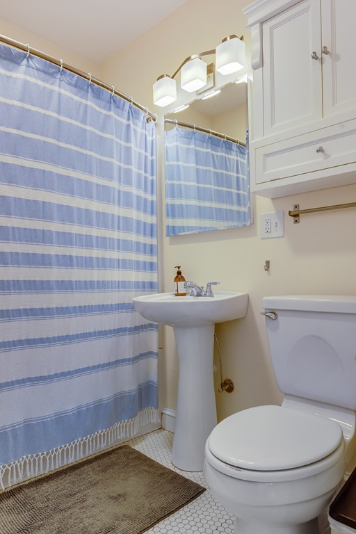 21 Pershing Road, Unit 2 Boston, MA 02130 - Photo 14 of 17 a bathroom with a toilet and a sink