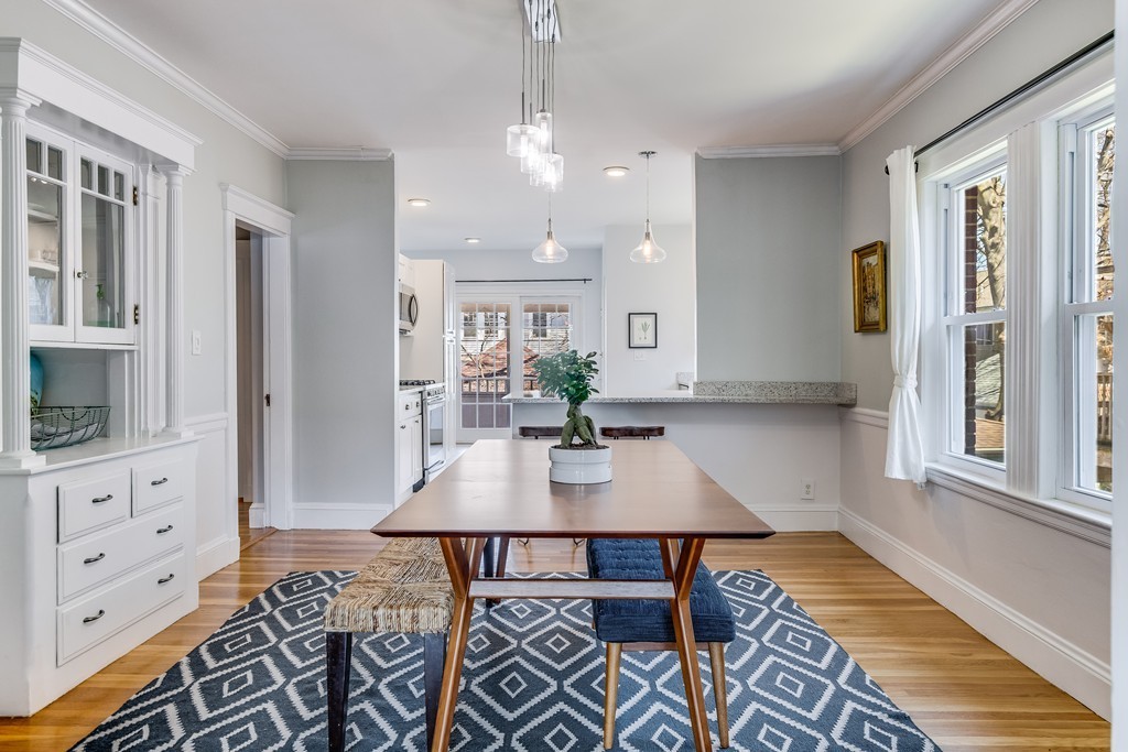 21 Pershing Road, Unit 2 Boston, MA 02130 - Photo 2 of 17 a view of a a dining room with furniture window and wooden floor