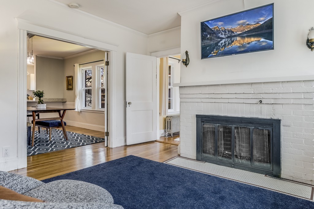 21 Pershing Road, Unit 2 Boston, MA 02130 - Photo 5 of 17 a living room with furniture and a fireplace
