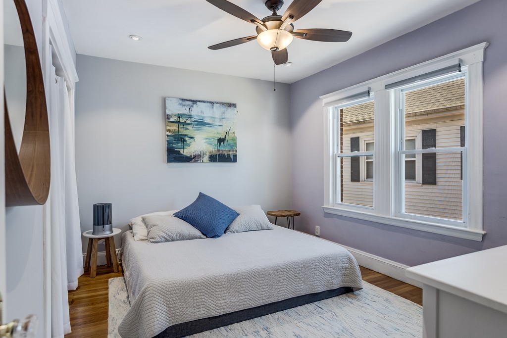 21 Pershing Road, Unit 2 Boston, MA 02130 - Photo 10 of 17 a bedroom with a large bed and a window