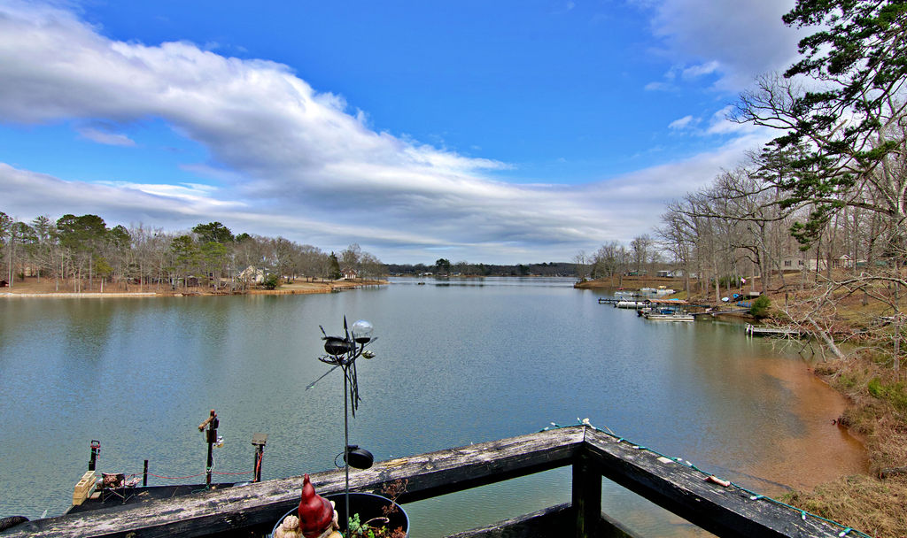 41 3rd Avenue Iva, SC 29655 - Photo 12 of 31 This tranquil waterfront setting offers expansive views of the serene lake and surrounding natural beauty.