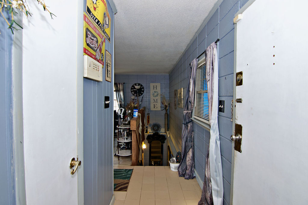 41 3rd Avenue Iva, SC 29655 - Photo 16 of 31 This inviting entrance features durable tile flooring and access to a lower level.