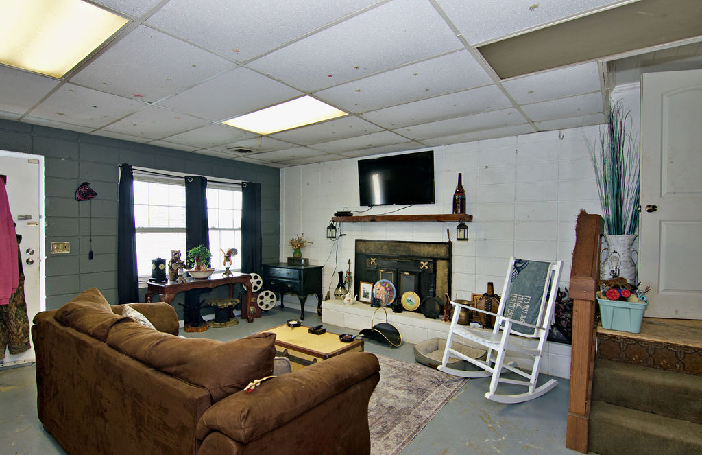41 3rd Avenue Iva, SC 29655 - Photo 21 of 31 This inviting living space features a cozy fireplace, perfect for relaxing evenings.