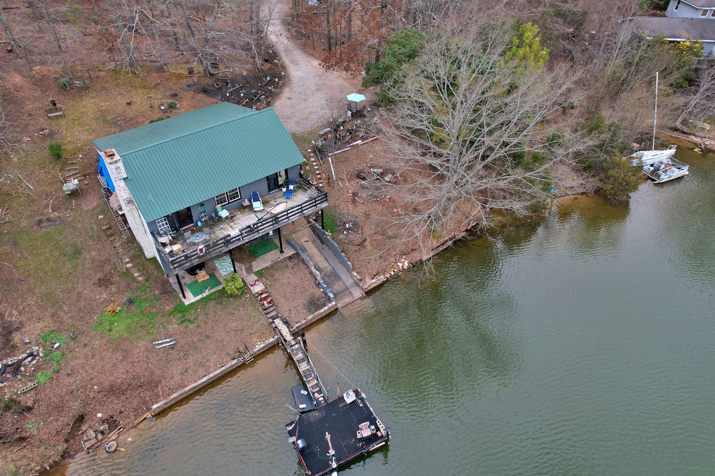 41 3rd Avenue Iva, SC 29655 - Photo 28 of 31 This charming waterfront retreat offers direct lake access and a private boat dock.