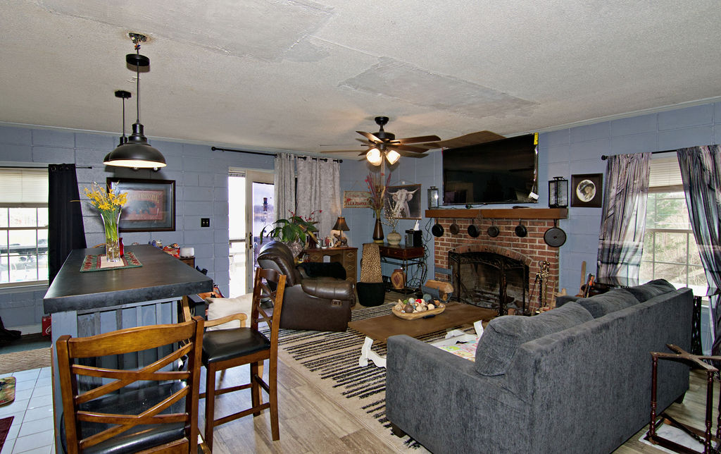 41 3rd Avenue Iva, SC 29655 - Photo 7 of 31 This inviting living space features a cozy fireplace, creating a warm and welcoming atmosphere for all.