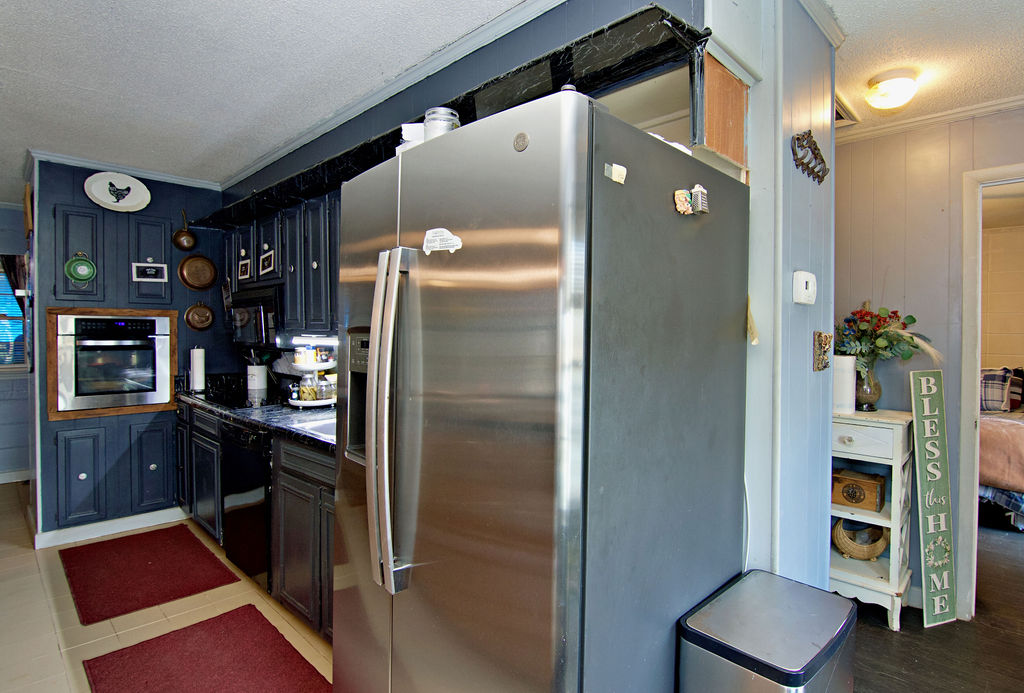 41 3rd Avenue Iva, SC 29655 - Photo 9 of 31 This cozy kitchen features sleek appliances and ample cabinet space for all your culinary needs.