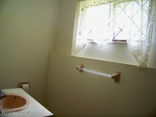 259 Devils Hole Road Cresco, PA 18326 - Photo 13 of 20 a close up of a wall with a window