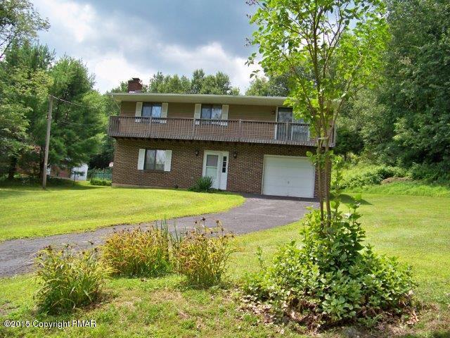 259 Devils Hole Road Cresco, PA 18326 - Photo 2 of 20 a front view of a house with a yard