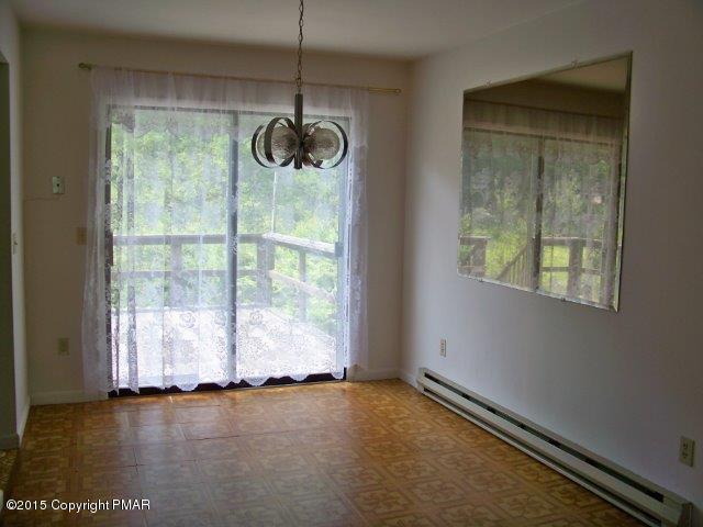 259 Devils Hole Road Cresco, PA 18326 - Photo 5 of 20 a view of an empty room with wooden floor and windows