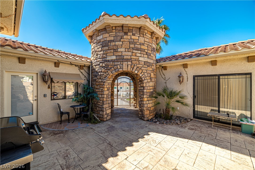 2181 Winery Road Pahrump, NV 89048 - Photo 6 of 52 Enter this private courtyard through a charming stone archway castle style tower leading you to the main home, guest quarters and the detached Casita.