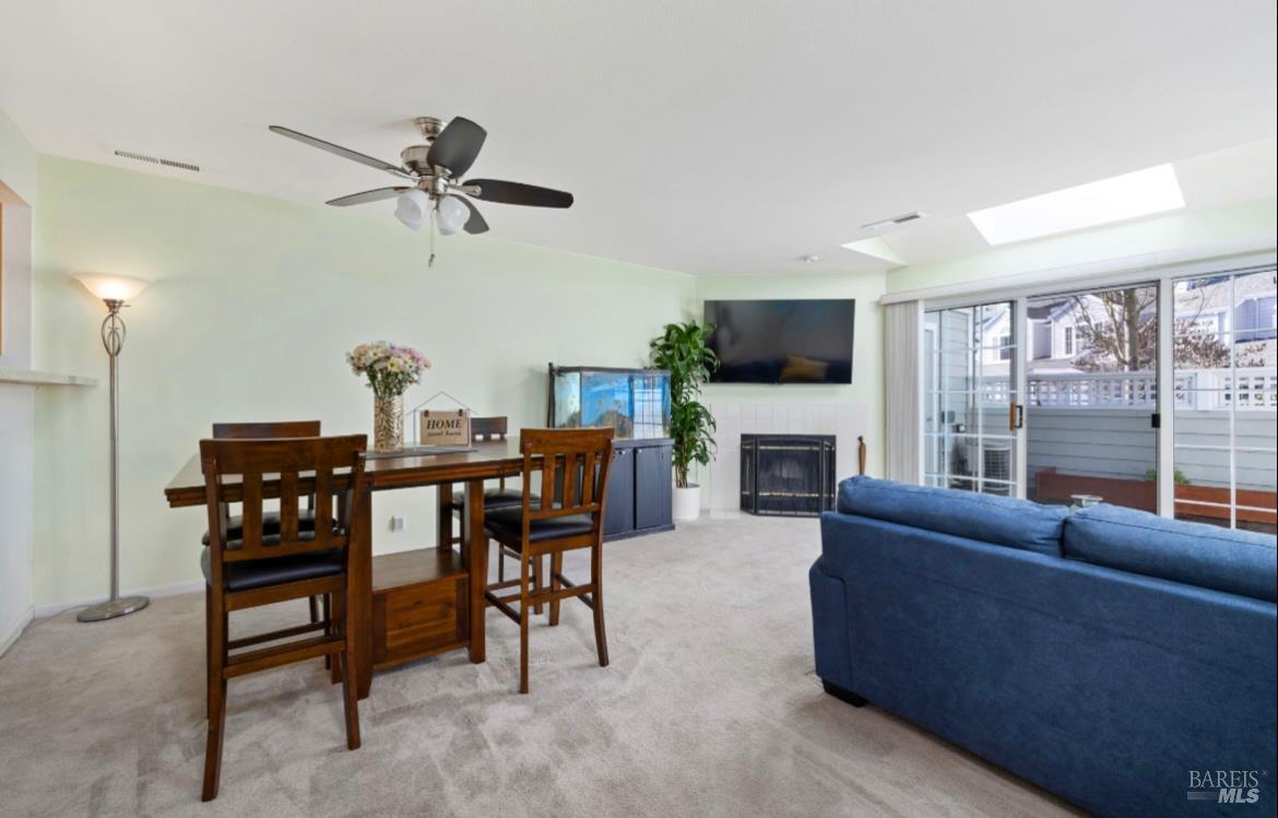605 Laurel Grove Circle Santa Rosa, CA 95407 - Photo 11 of 29 a living room with furniture a fireplace and a flat screen tv