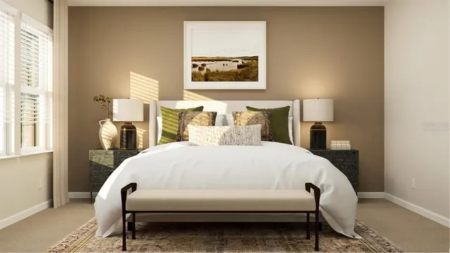 a bed sitting in a bedroom next to a window